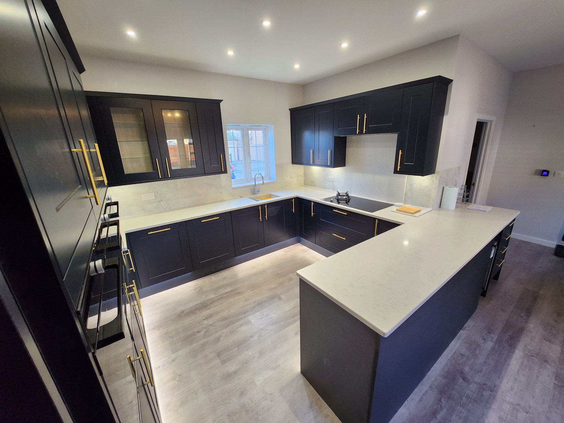 Dark cabinetry and island installation