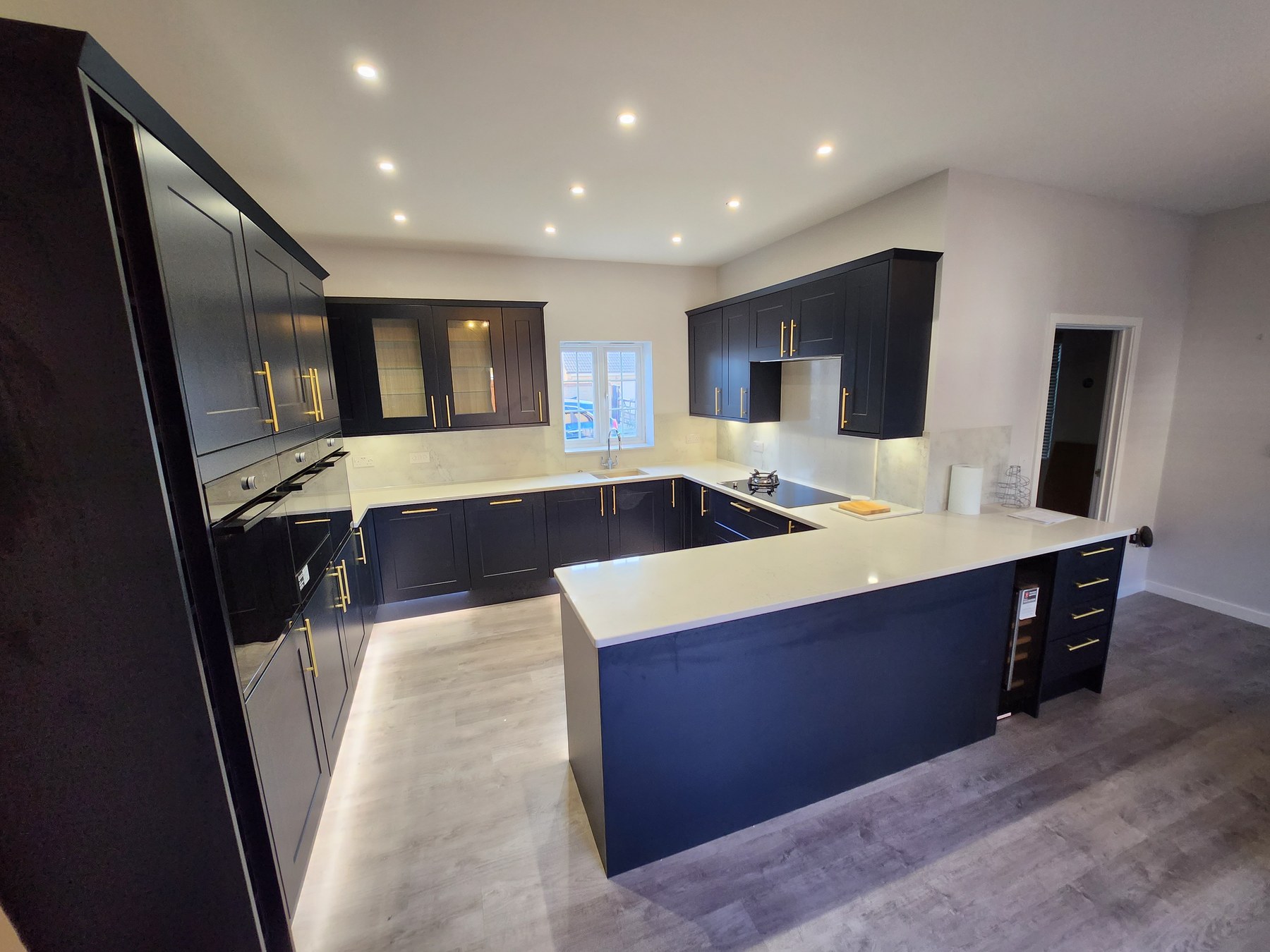 Completed navy kitchen by Cambridge Kitchen Solutions